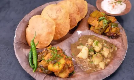 A complete Netram Thali Prayagraj arranged on a plate with all dishes