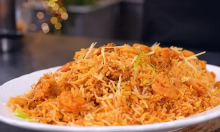 Resting and serving the finished prawn biryani.