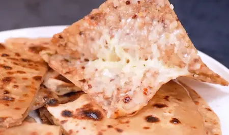 Step 6: Serving cheese burst aloo paratha with curd and butter