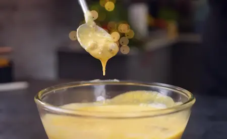 Creamy makhana kheer garnished with nuts and mango puree