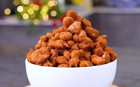 Crispy masala peanuts cooling on a plate