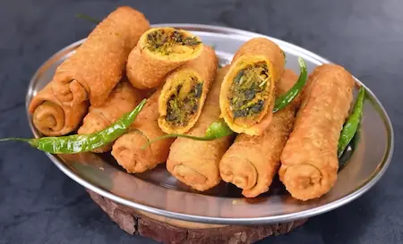 Slicing and serving hot sambar vadi with green chutney and tea