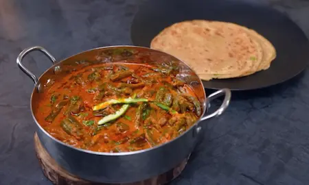 preparing namak mirchi paratha for french beans curry recipe