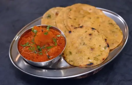 Tawa-cooking the rice flour poori for Shakarkand Curry pairing