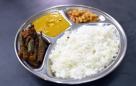 Step 7: serving varan bhaat and masala bhendi recipe with koshimbir