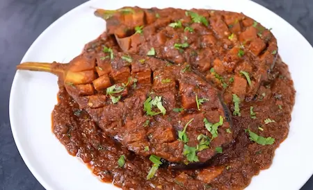 Step 8: Serving Special Baingan Masala hot with roti or rice
