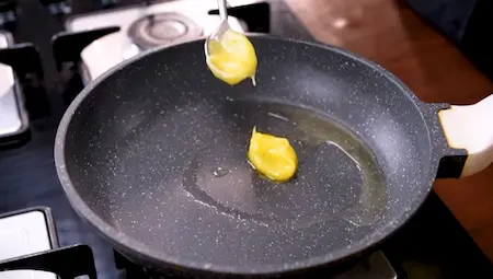 Step 2: heating oil and ghee for Aloo Matar ki Sukhi Sabzi