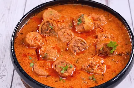 Step 6: combining gatta pieces with gravy for Gatte Ki Sabji