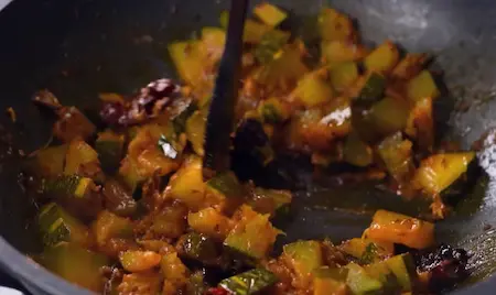 Kaddu Ki Sabzi with pumpkin cubes cooked in mustard oil and spices
