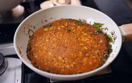 Cooking handvo batter over tempering in non-stick pan