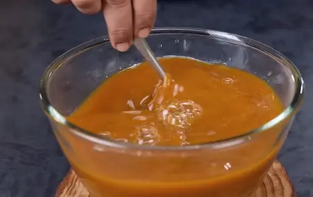 Blending tamarind, mint, spices for tangy chatpata pani used in pani phulki