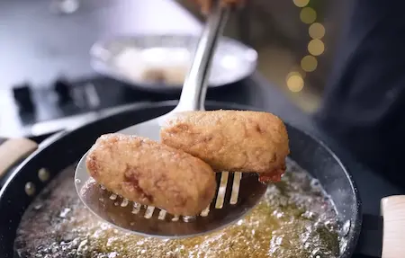 Frying Kolkata Beetroot Chop until golden and crispy