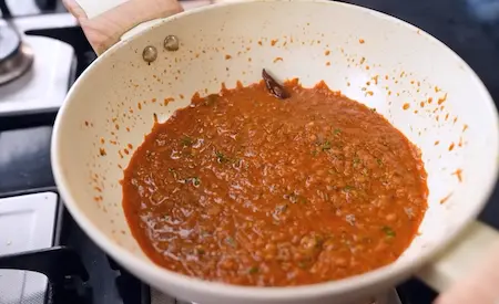 Final spiced and buttery Chatpata Lauki gravy ready for adding fried lauki slices.