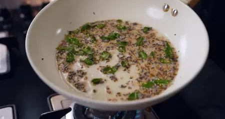 Gujarati tempering for handvo with mustard, sesame, curry leaves