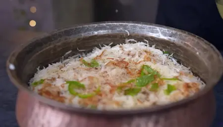 Final layer of rice and toppings for Mushroom Biryani