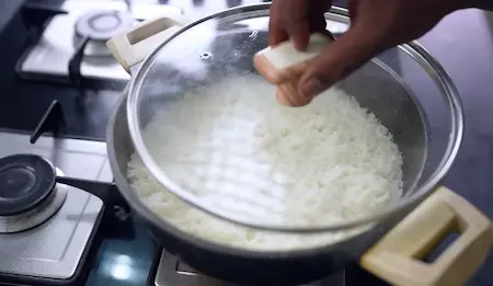 Step 5: cooking rice for varan bhaat and masala bhendi recipe