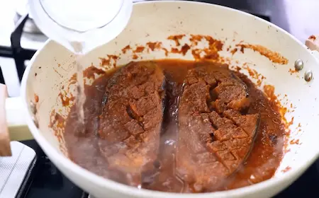 Step 6: Combining brinjal with masala for Special Baingan Masala