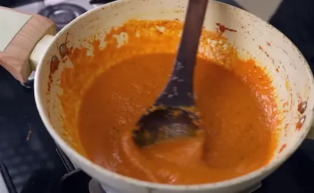 Step 6: Cooking moong dal pakoda curry with curd mixture