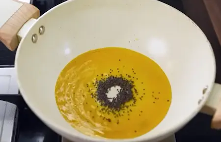 Step 3: tempering mustard seeds in mustard oil for Gajar Matar Ki Sabji