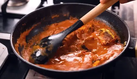 Step 6: Final sizzling and finishing of Paneer Changezi on a hot pan with cream and ginger julienne