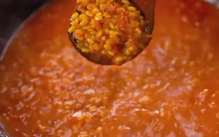 Cooking the dal until soft and creamy