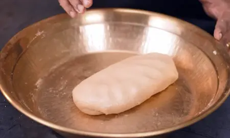 Mixing wheat flour, suji, and kneading the dough for pooris
