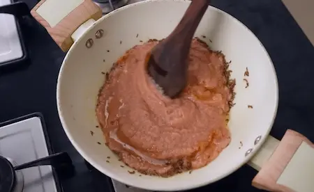 Step 5: Sautéing onion-tomato paste for pakoda curry