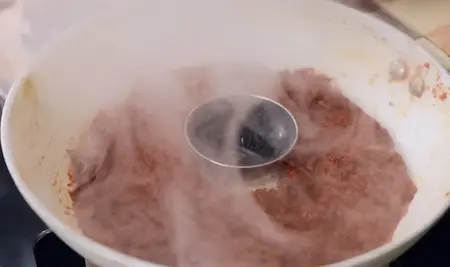 Step 7: giving smoky charcoal flavour to garlic chutney