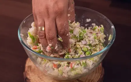 Step 3: Adding ginger, green chilli and coriander to poha mixture for Easy 10-Minute Poha Snack
