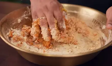 Step 2: Mixing besan dough with spices, curd and sesame seeds for Fulwadi