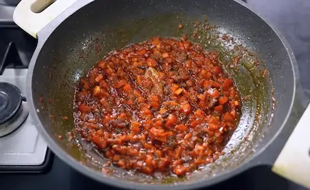 Soya kheema cooked with onions, tomatoes, and spices in a pan for Soya Kheema Karela Recipe