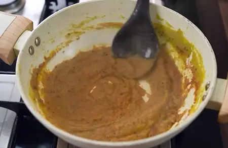 Step 5: adding powdered spices to Gajar Matar Ki Sabji