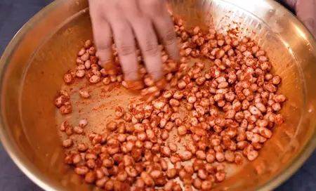 Raw peanuts mixed with ginger garlic paste and spices