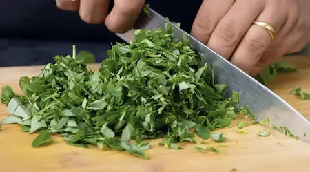 Step 3: chopping spinach and fenugreek leaves for Methi Palak Ka Kapa