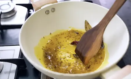 Step 2: tempering spices in mustard oil for Ghugni Chaat