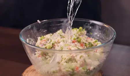 Step 4: Adding rice flour and besan to prepare batter for Easy 10-Minute Poha Snack