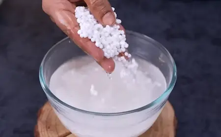 Soaking sabudana pearls in water until soft and fluffy