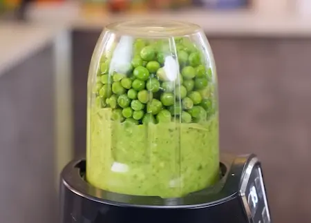 Step 1: grinding green peas, green garlic and chilli for Green Garlic and Matar Paratha Recipe