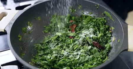 Step 5: cooking chopped and pureed greens for Methi Palak Ka Kapa