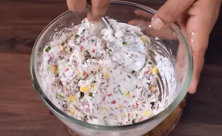 Step 3: mixing hung curd and vegetables for Crispy Dahi Sandwich Recipe