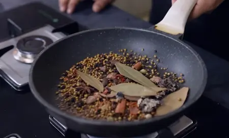 Dry roasting whole spices for Mushroom Biryani masala